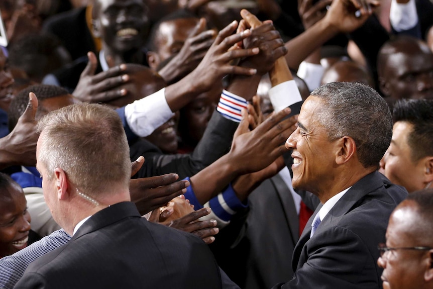 The crowd surges toward Barack Obama at an indoor stadium in Nairobi