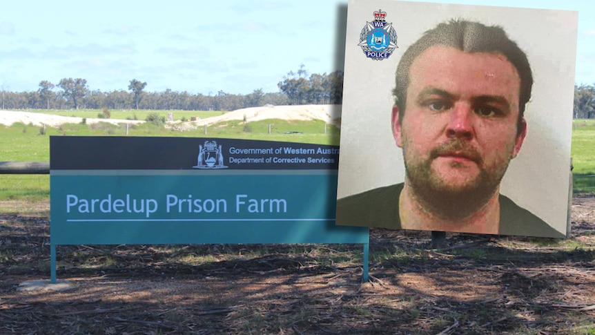 A sign in front of a regional prison with an inset picture of a bearded man with short dark hair.