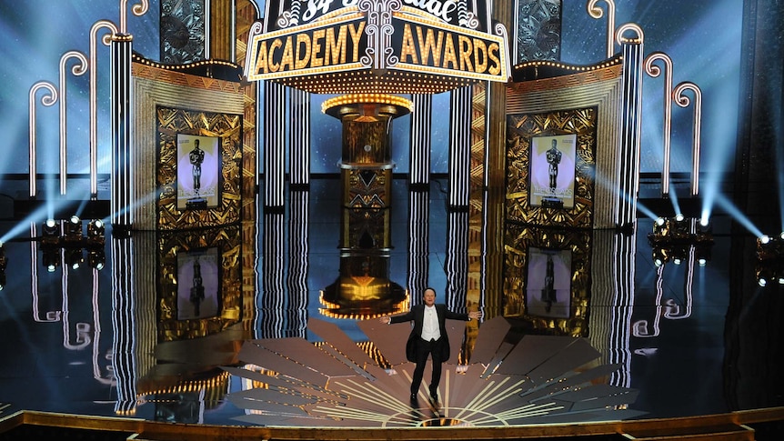 Oscars host Billy Crystal opens the ceremony