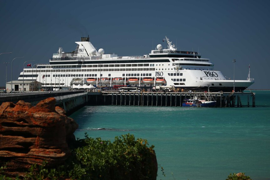 A cruise ship docked at the existing jetty in Broome at high tide.