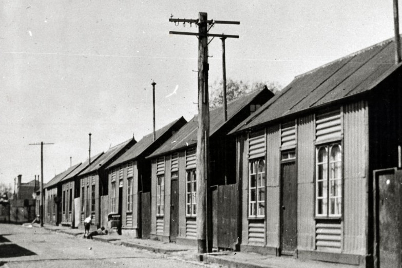 Black and white photo of historic iron prefabricated homes in South Melbourne.