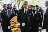 Pallbearers bring the coffin into The Fountain of Praise church in Houston for the funeral for George Floyd.