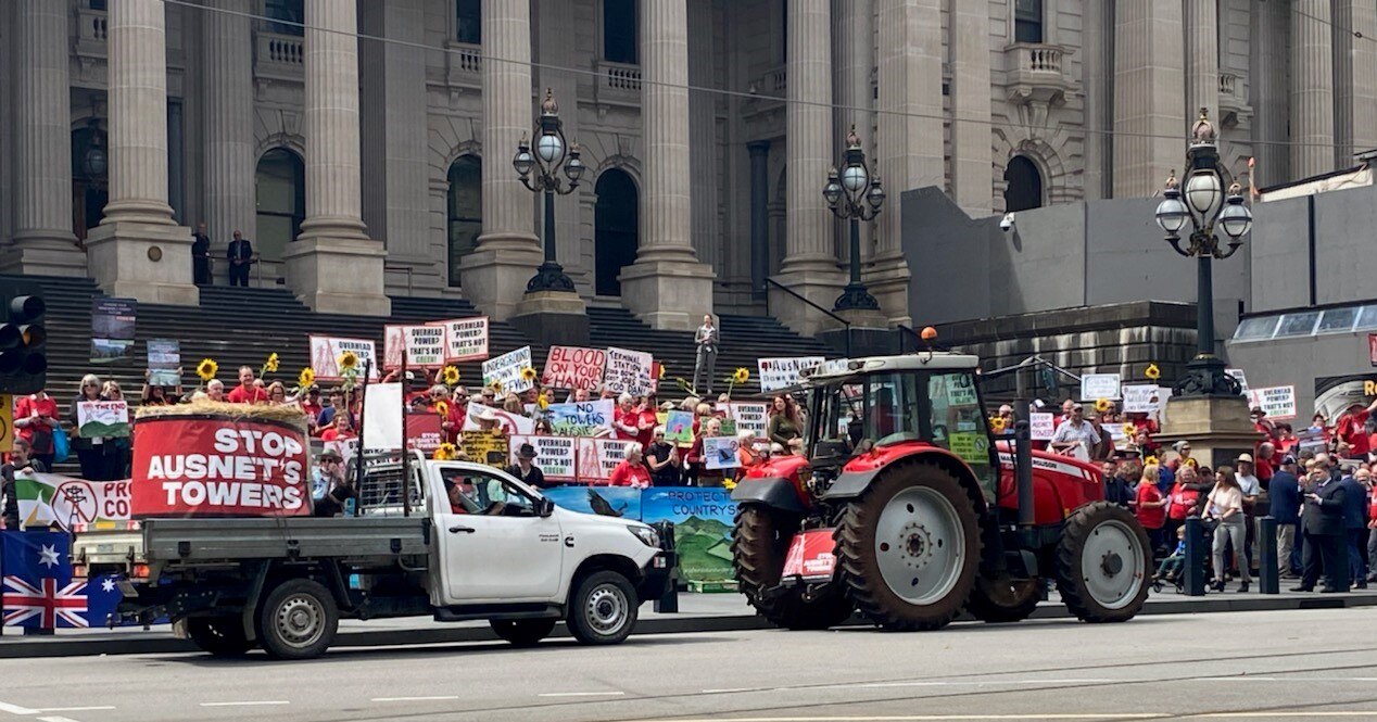 Tractors driving past Parliament House