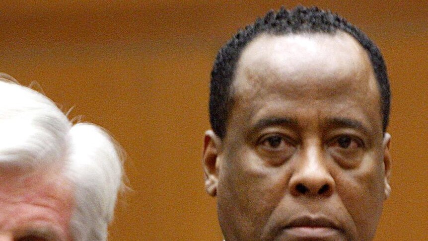 Dr Conrad Murray, right, appears with a member of his defence team