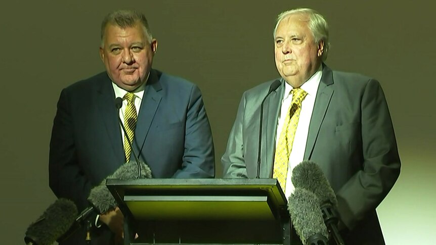 Craig Kelly and Clive Palmer talking to reporters