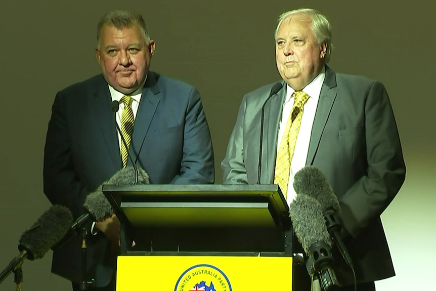 Craig Kelly and Clive Palmer speaking to reporters