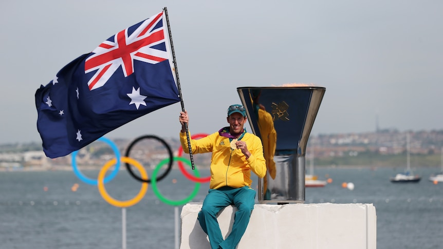 Malcolm Page waves flag