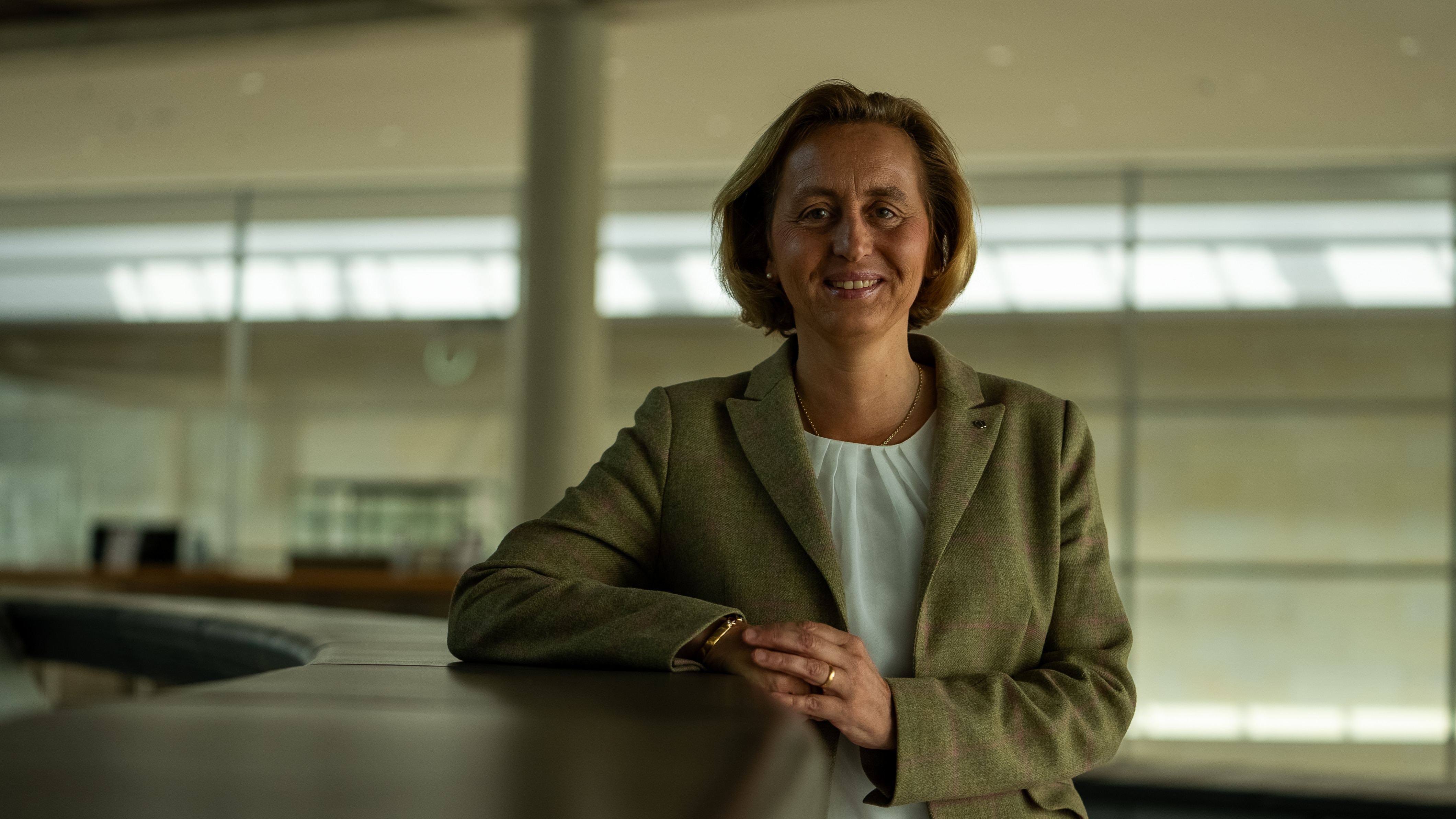 A woman looks at the camera. 