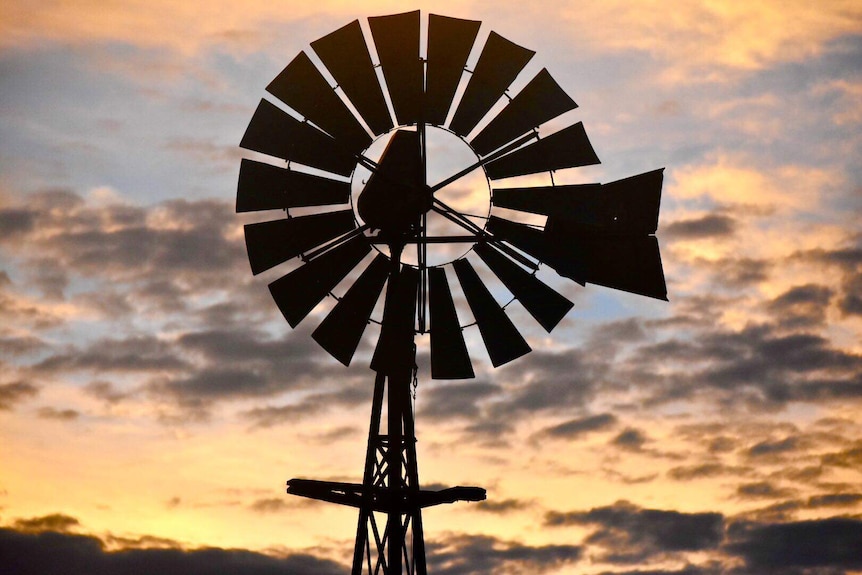 The sunset eclipses a windmill in Ti Tree in the Northern Territory.