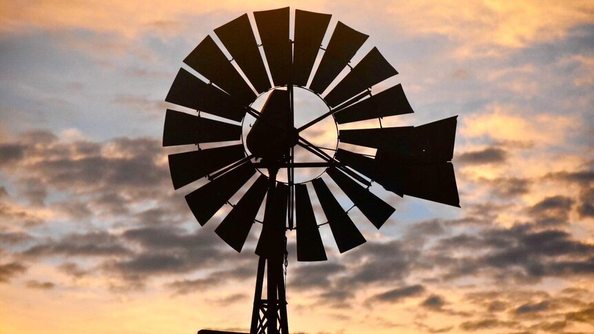 The sunset eclipses a windmill in Ti Tree in the Northern Territory.