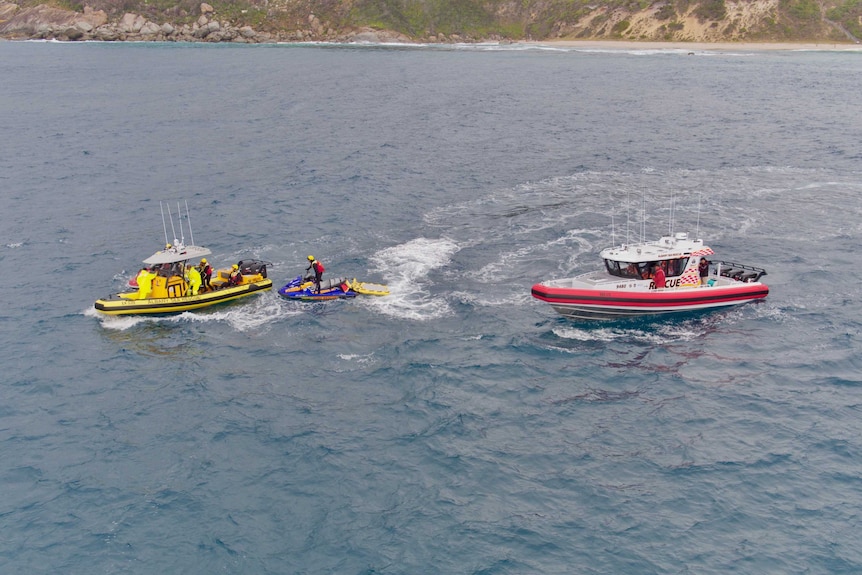 An aerial view of two sea rescue boats and a jet-ski in the water at Salmon Holes in Albany.