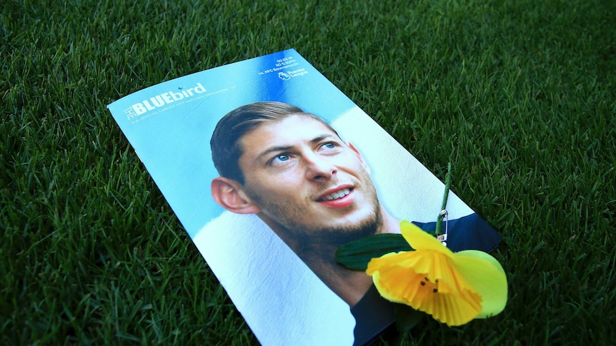 Sala's face on the cover of the Cardiff City magazine, with a yellow flower on top