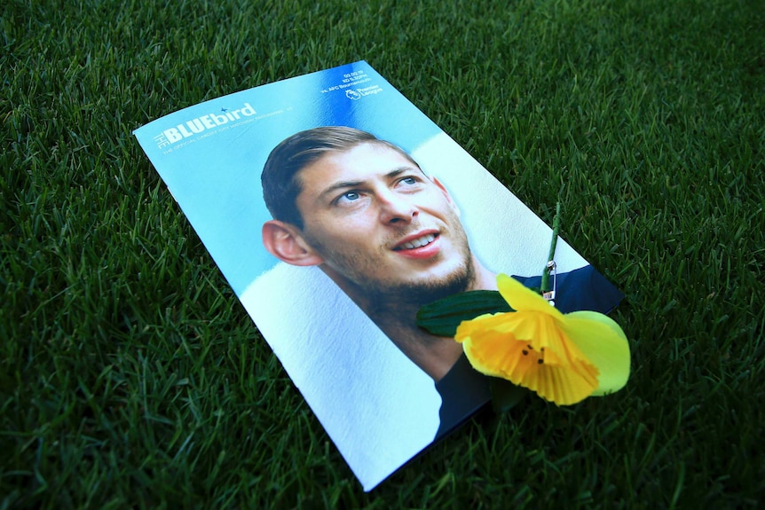 Sala's face on the cover of the Cardiff City magazine, with a yellow flower on top