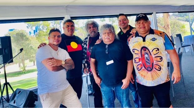 An image of Mop & the Dropouts band players in a group