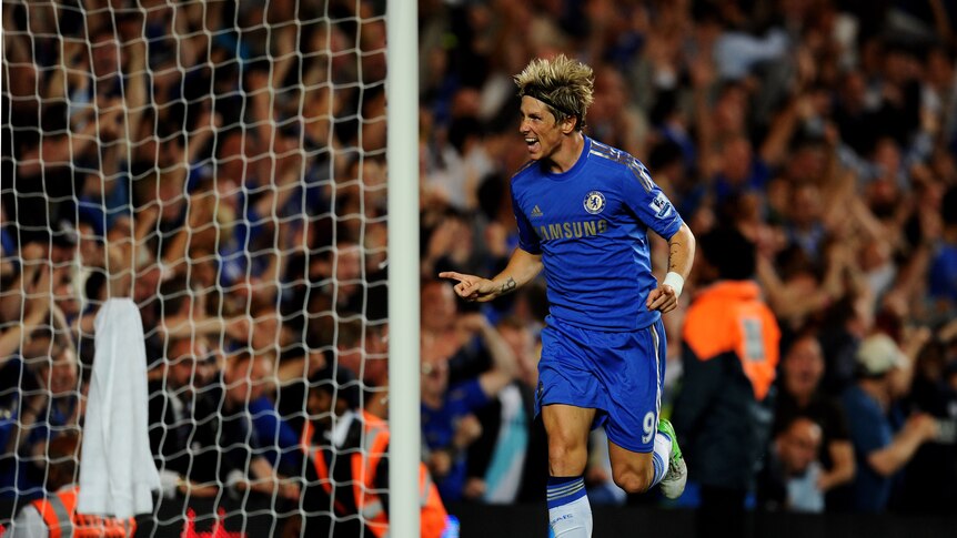 On target ... Fernando Torres celebrates scoring Chelsea's third goal