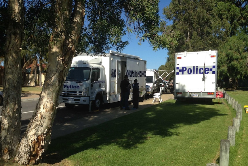Police at the Atwell property where Jamie Devine was stabbed during a brawl at a party.