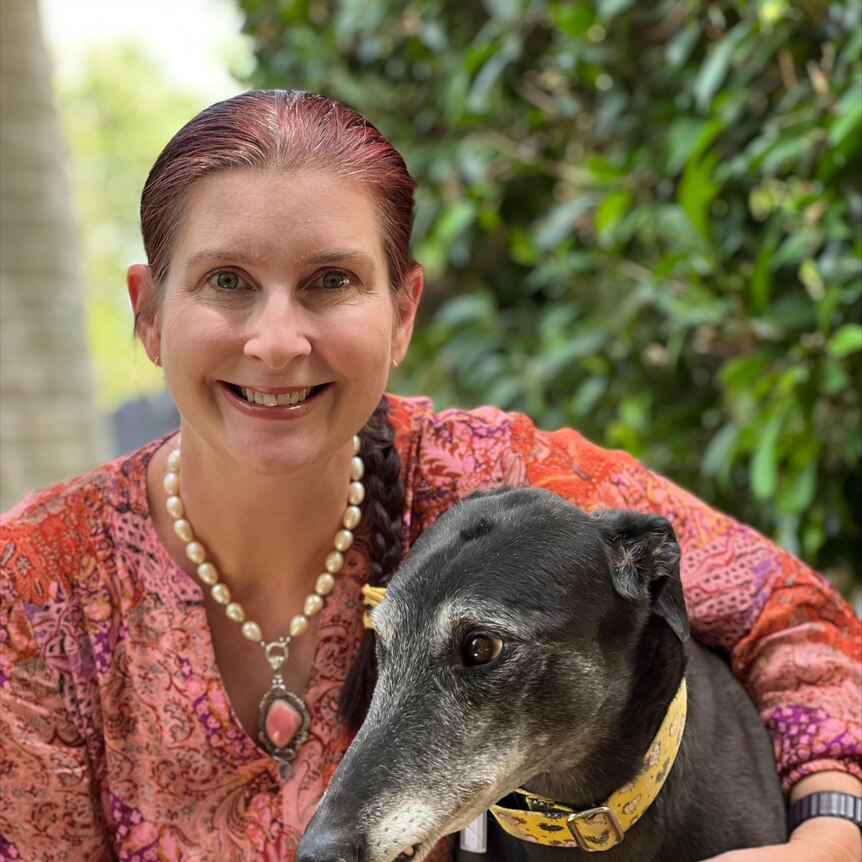 woman with greyhound dog 