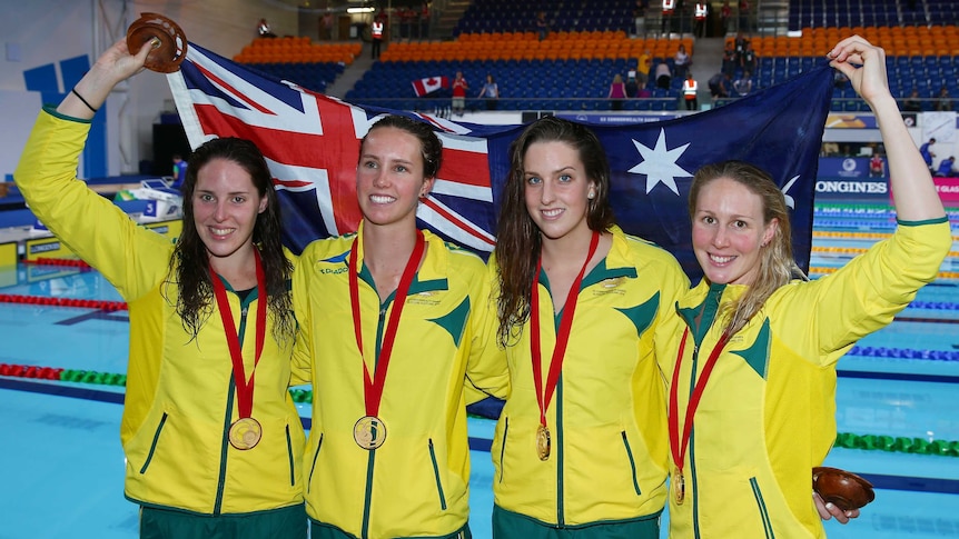 Australia's 4 x 200m relay team shows off their gold medals