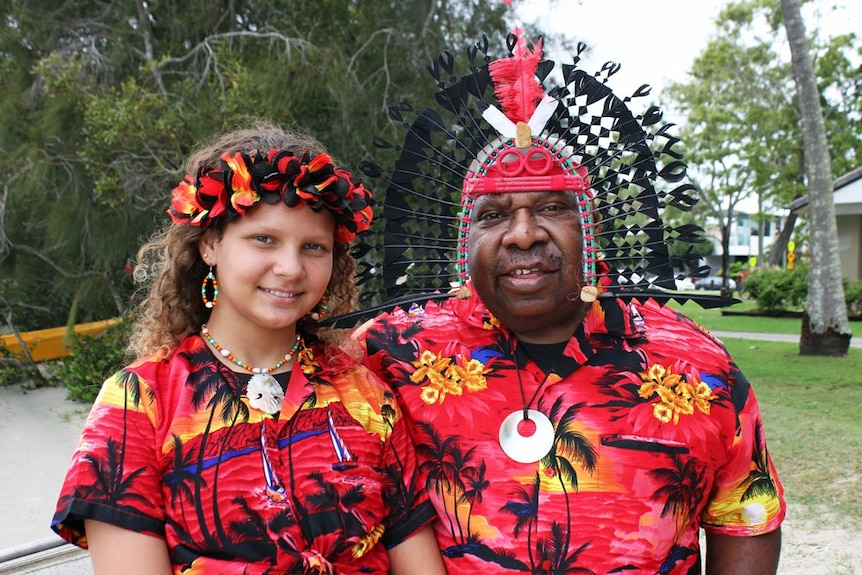 Torres Strait Island elder and young girl in colourful clothes