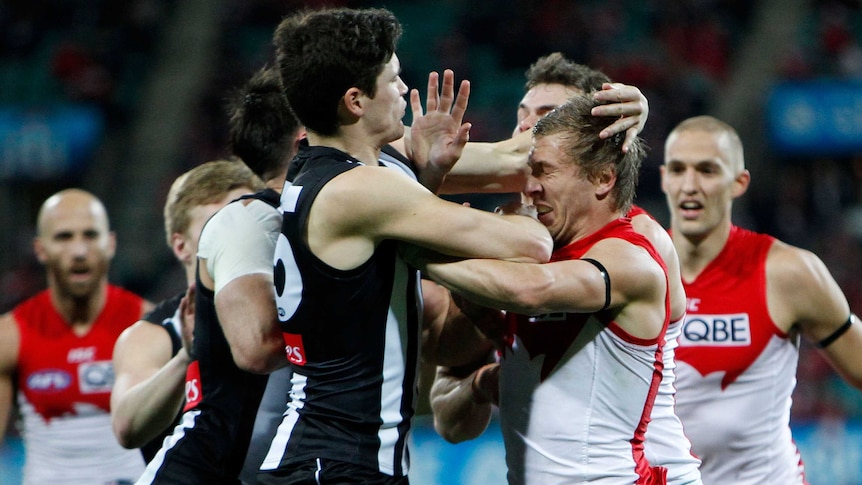 Collingwood's Jack Crisp and Sydney's Kieren Jack scuffle at the SCG in round 20, 2015.