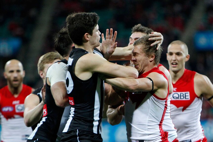 Collingwood's Jack Crisp and Sydney's Kieren Jack scuffle at the SCG in round 20, 2015.