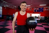 Hassan Haidary holds a medicine ball