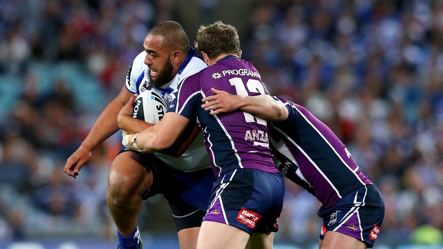 Shut down ... Sam Kasiano meets the Storm defence in the grand final