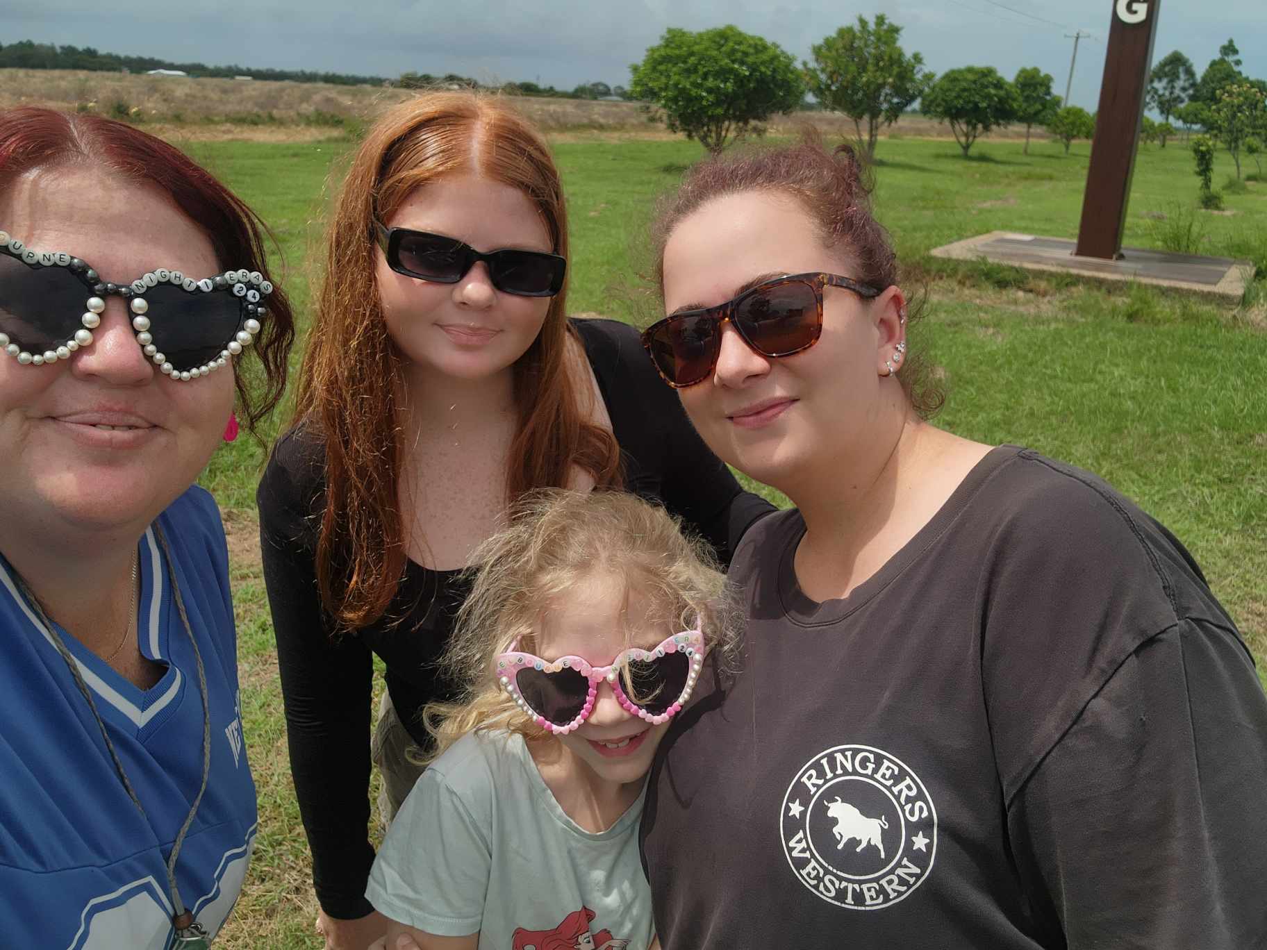 Four women and girls wearing sunglasses