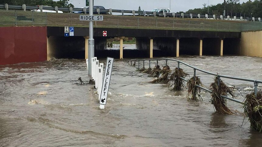 A pedestrian and cycle path flooded at Greenslopes in Brisbane
