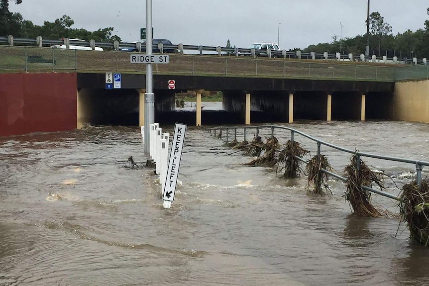 A pedestrian and cycle path flooded at Greenslopes in Brisbane