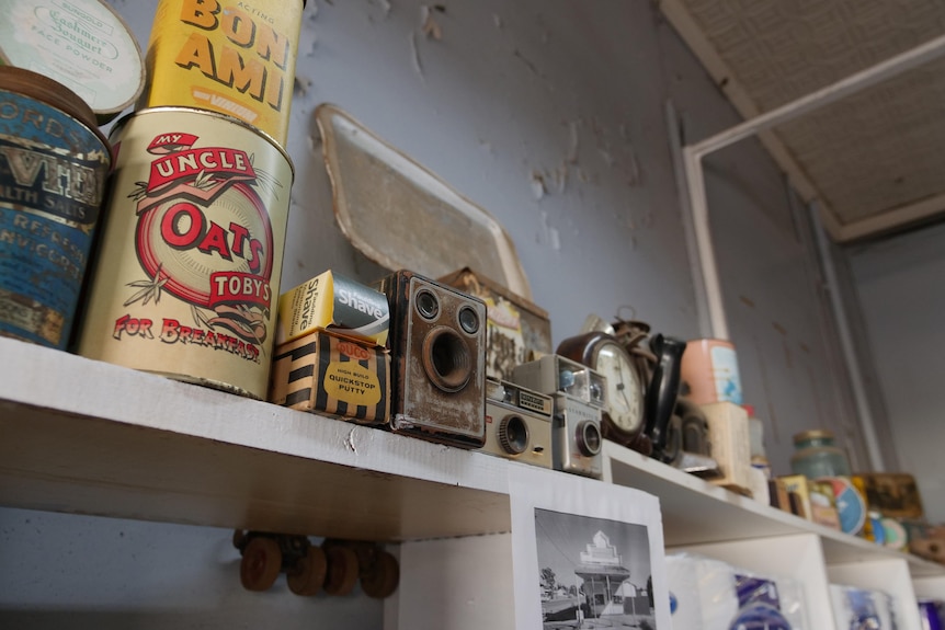 Old-fashioned artefacts on a shelf in an old shop