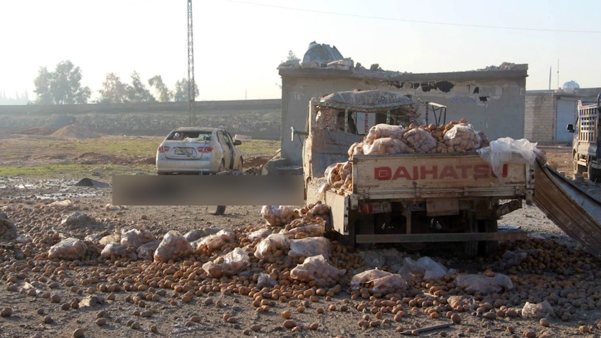 The aftermath of a bombing at a vegetable market.