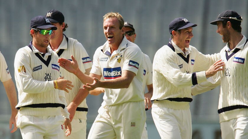 Damien Wright celebrates a wicket