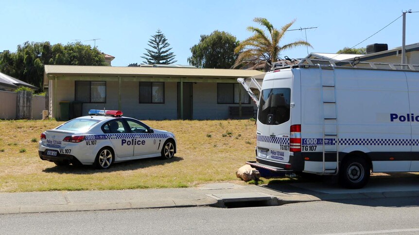 A police car and a van outside the Madora Bay property.