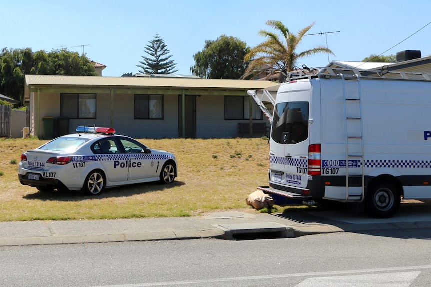 A police car and a van outside the Madora Bay property.