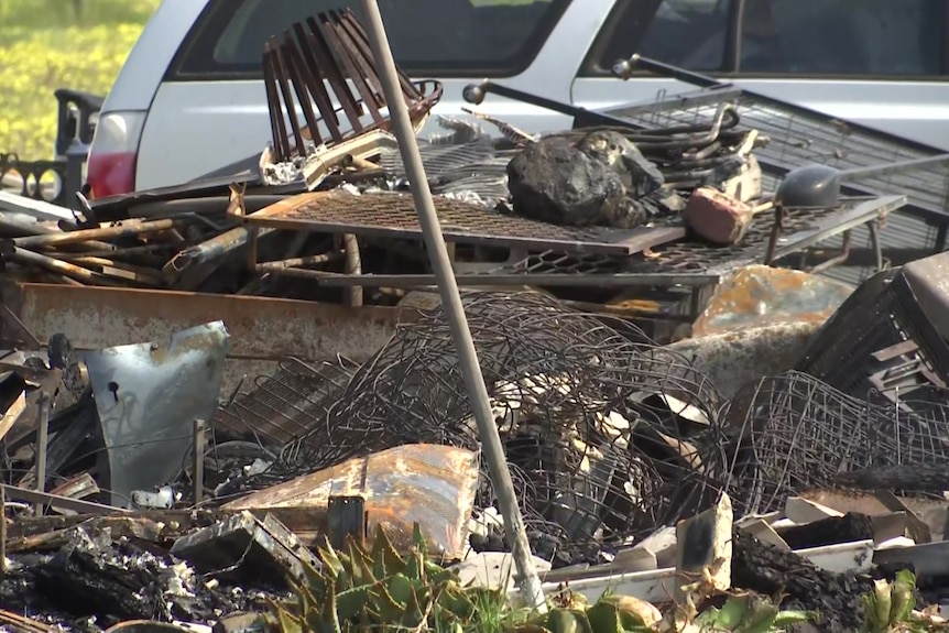 The charred remains of the inside of a home destroyed by fire