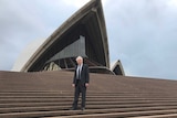 Steve Tsoukalas stands on the steps of the Sydney Opera House
