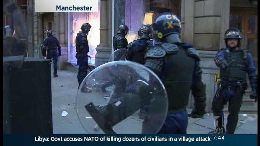Police clash with rioters in Manchester