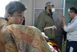 A young man recovers from what is believed to be a chlorine gas attack in the village of Sarmin in Syria's north-western province of Idlib.