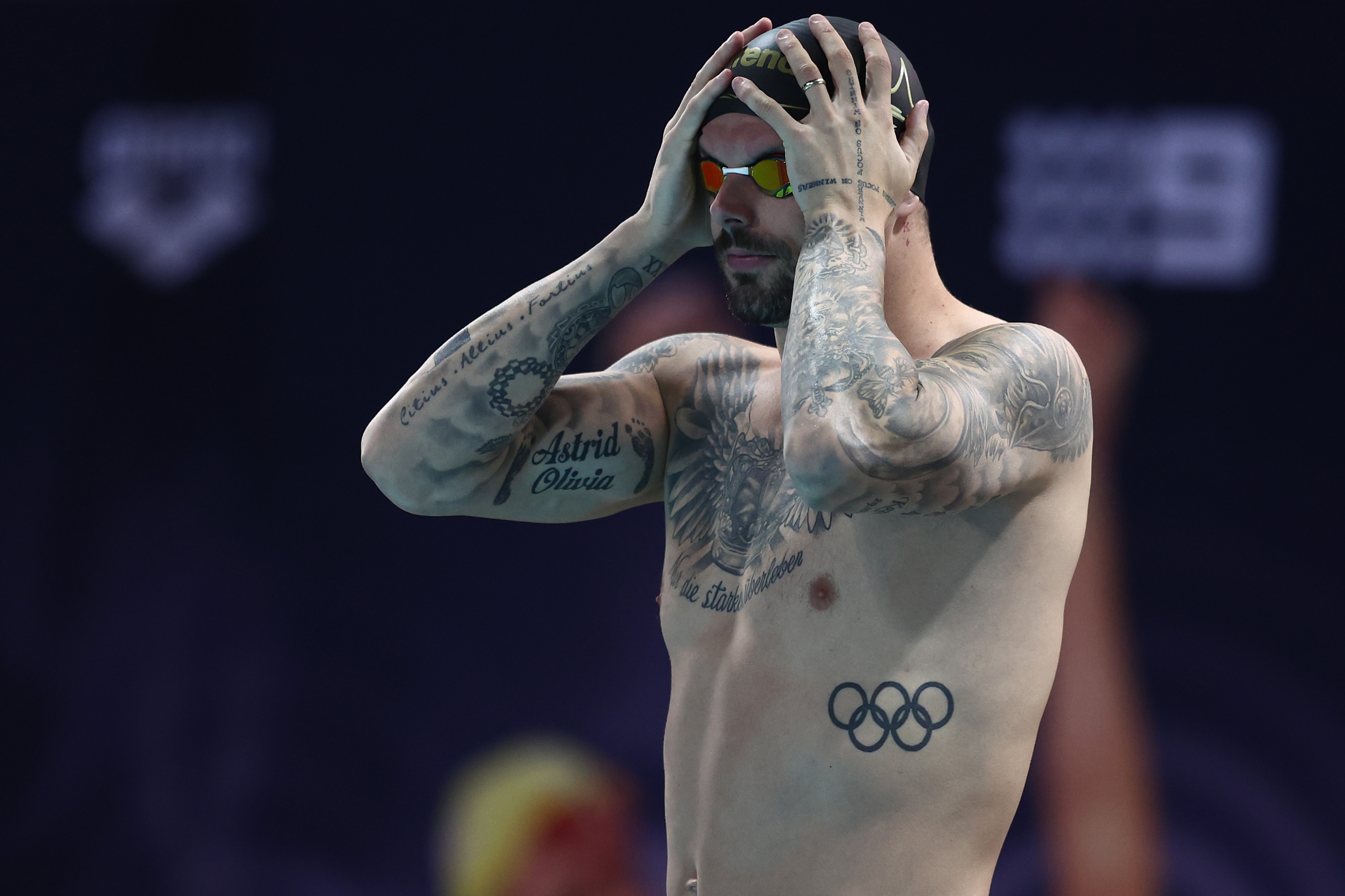 Kyle Chalmers holds his head