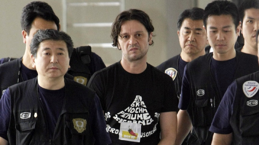Rifat Hadziahmetovic, a member of the Pink Panther gang of international jewel thieves, arrives in Japan