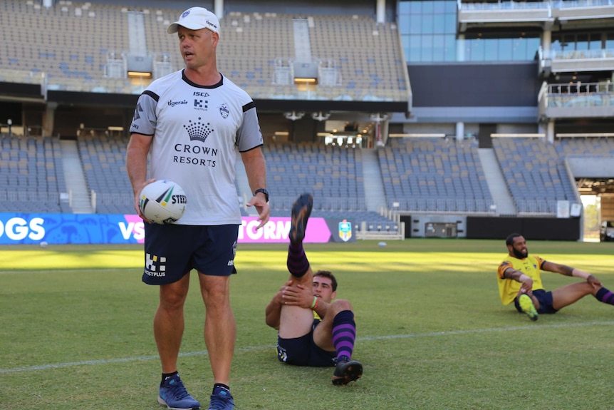 Lachlan Penfold (L), director of performance at Melbourne Storm, at training.