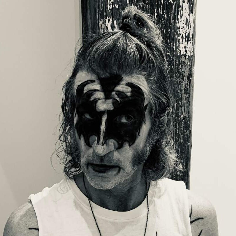 You Am I frontman Tim Rogers poses while wearing the stage face paint of Kiss bass player Gene Simmons