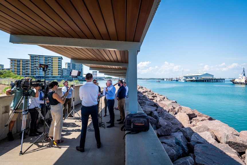 reporters gathered at darwin harbour