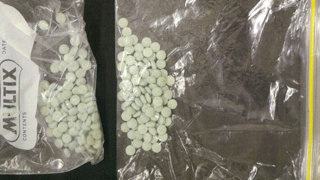 Illicit drugs in pill form in two snap-lock bags seized by Perth police.