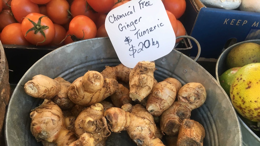 Ginger and turmeric for sale at a farmers' market.