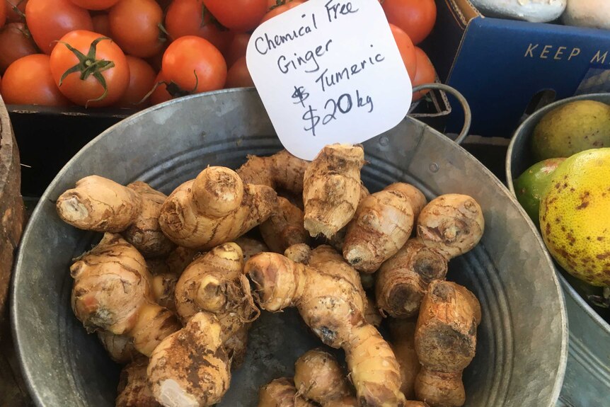 Ginger and turmeric for sale at a farmers' market.