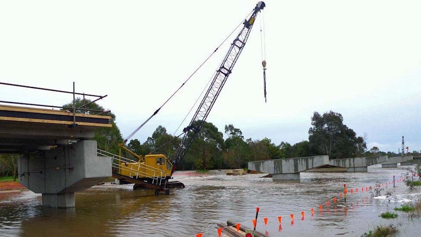 Authorities say it could be days before the water recedes enough for the highway to be re-opened.