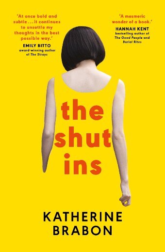 A yellow book cover featuring a woman with a bob haircut facing away, her yellow dress fading into the background