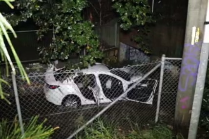 A white car in a stormwater canal